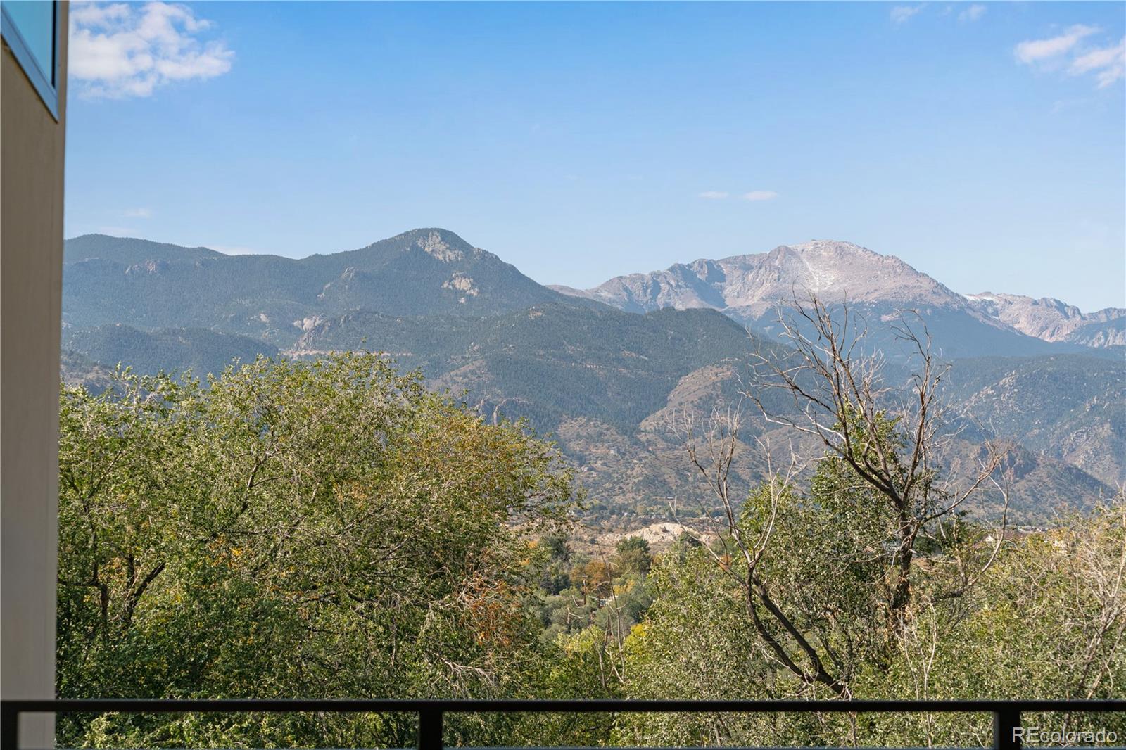2260 Glenn Street Colorado Springs, CO 80904 - Photo 24 of 45 a view of a mountain range with lush green forest