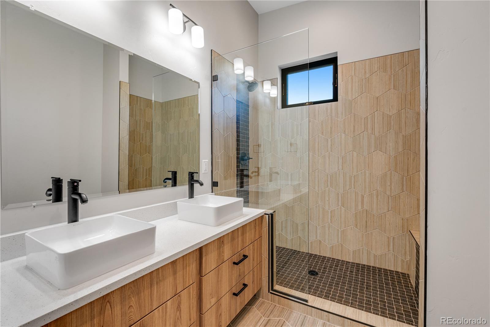 2260 Glenn Street Colorado Springs, CO 80904 - Photo 28 of 45 a bathroom with a sink and a mirror