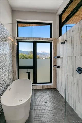 a picture of a bench in front of a wall