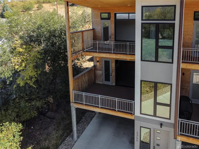 a view of a kitchen with a sink and a refrigerator