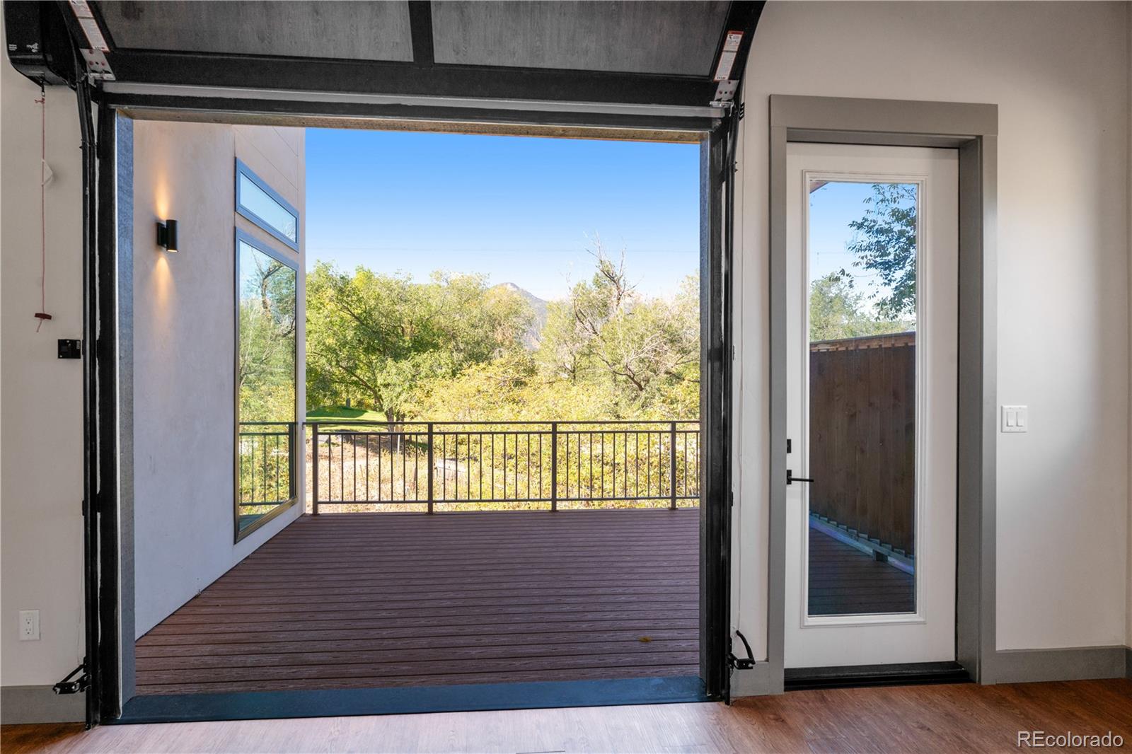 2260 Glenn Street Colorado Springs, CO 80904 - Photo 7 of 45 a view of a balcony with wooden floor