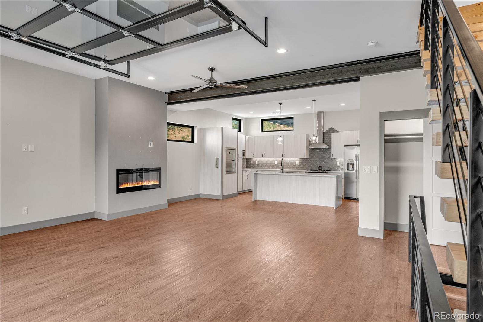 2260 Glenn Street Colorado Springs, CO 80904 - Photo 9 of 45 a view of a kitchen with refrigerator and wooden floor