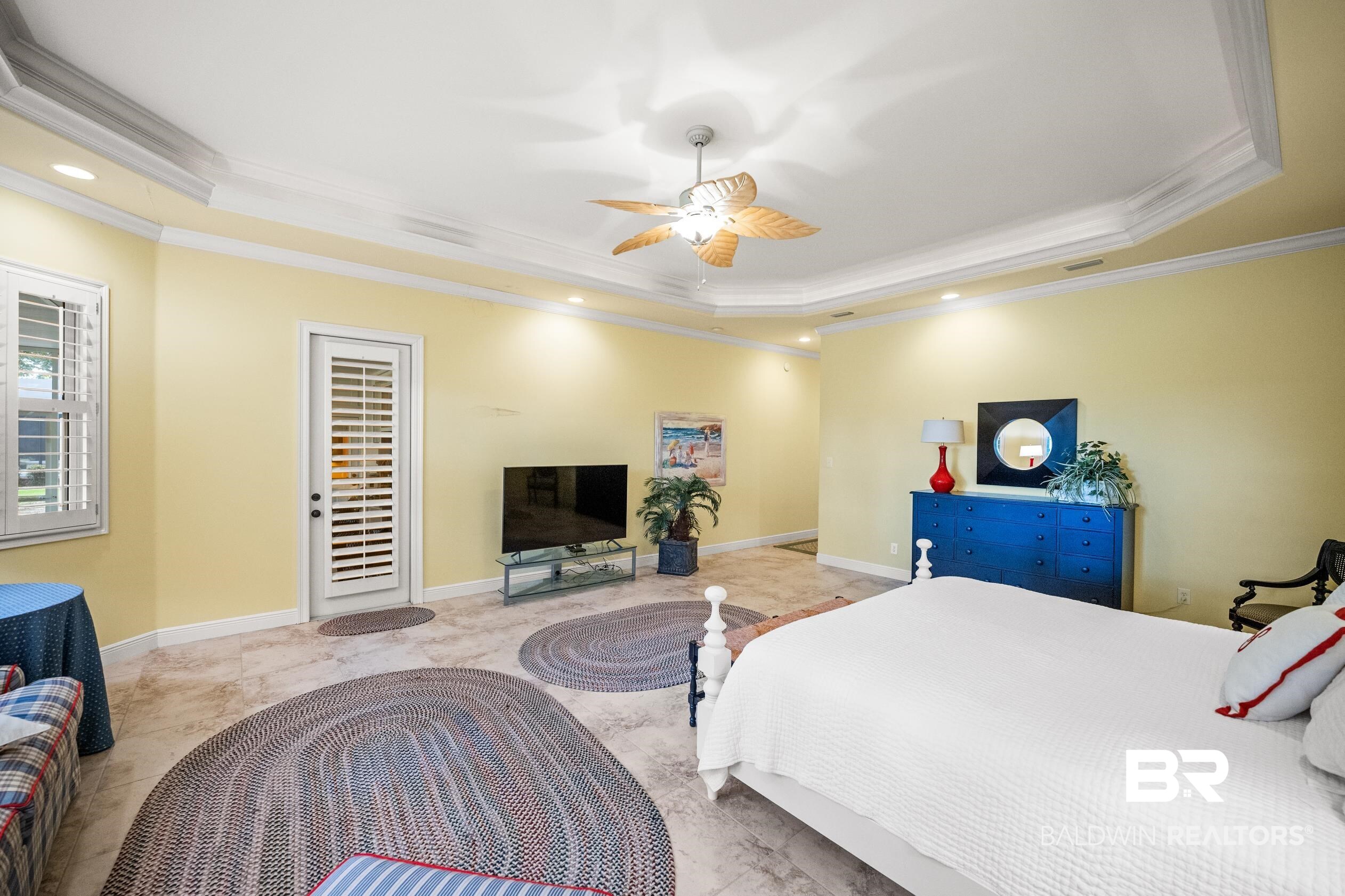 404 Peninsula Boulevard Gulf Shores, AL 36542 - Photo 23 of 51 Bedroom with ornamental molding, a tray ceiling, ceiling fan, and recessed lighting