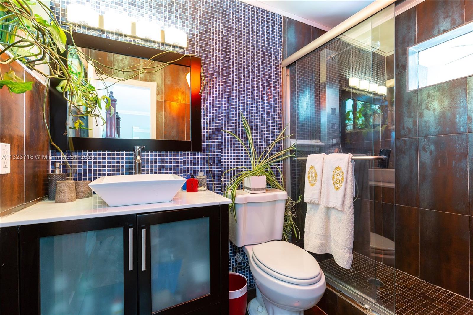 2743 Southwest 32nd Avenue Miami, FL 33133 - Photo 15 of 33 a bathroom with a sink toilet and shower