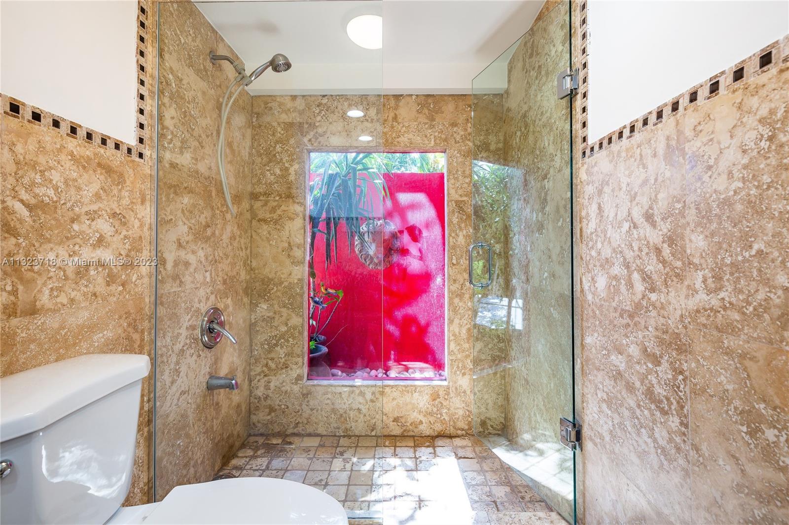 2743 Southwest 32nd Avenue Miami, FL 33133 - Photo 19 of 33 a bathroom with a toilet and a shower curtain