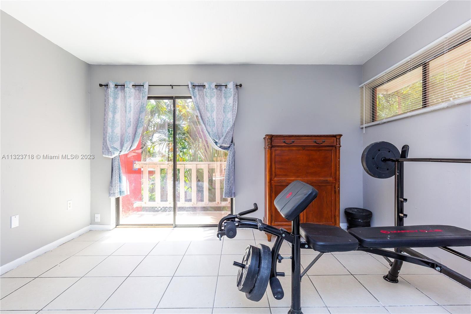 2743 Southwest 32nd Avenue Miami, FL 33133 - Photo 21 of 33 a view of a workspace with furniture and a window