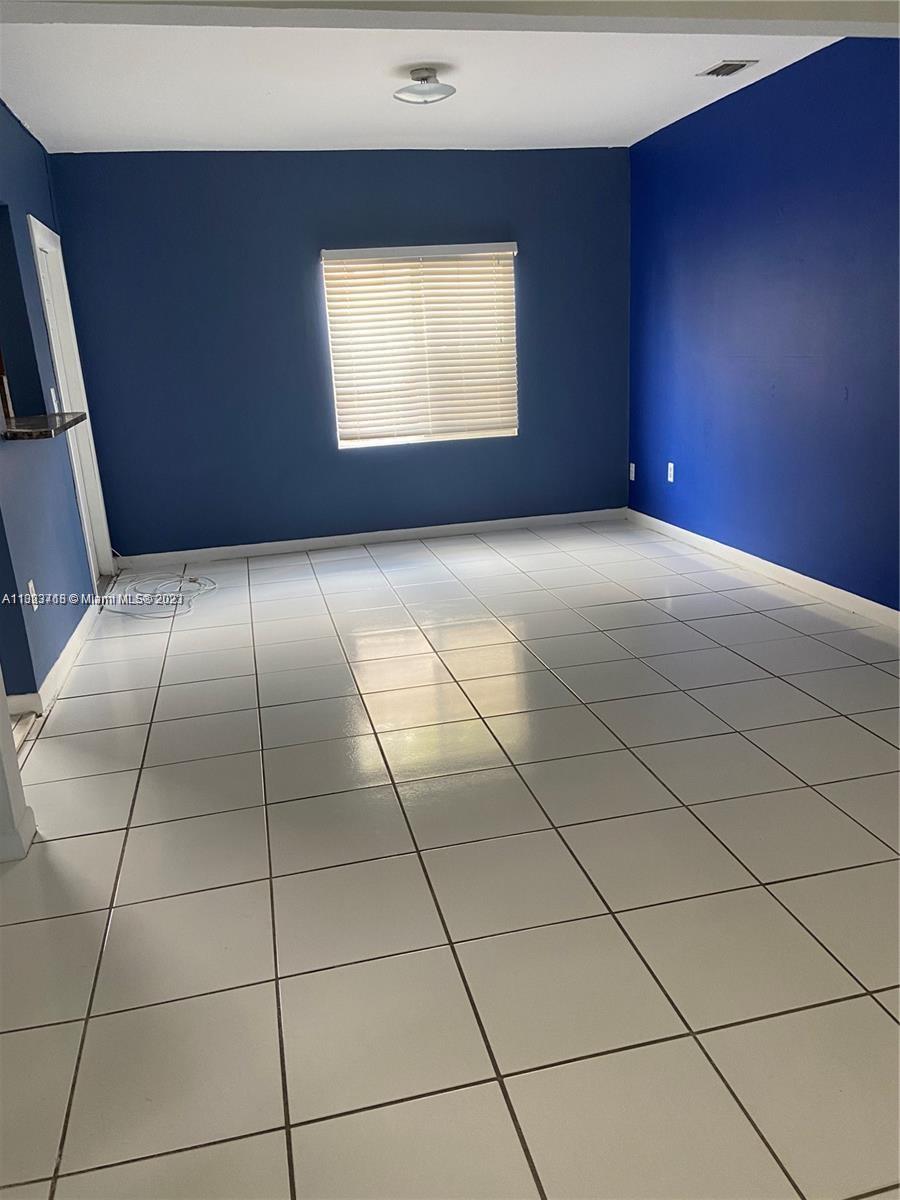 2743 Southwest 32nd Avenue Miami, FL 33133 - Photo 26 of 33 a view of an empty room with a window