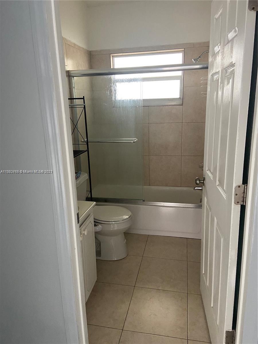 2743 Southwest 32nd Avenue Miami, FL 33133 - Photo 29 of 33 a bathroom with a shower and a toilet