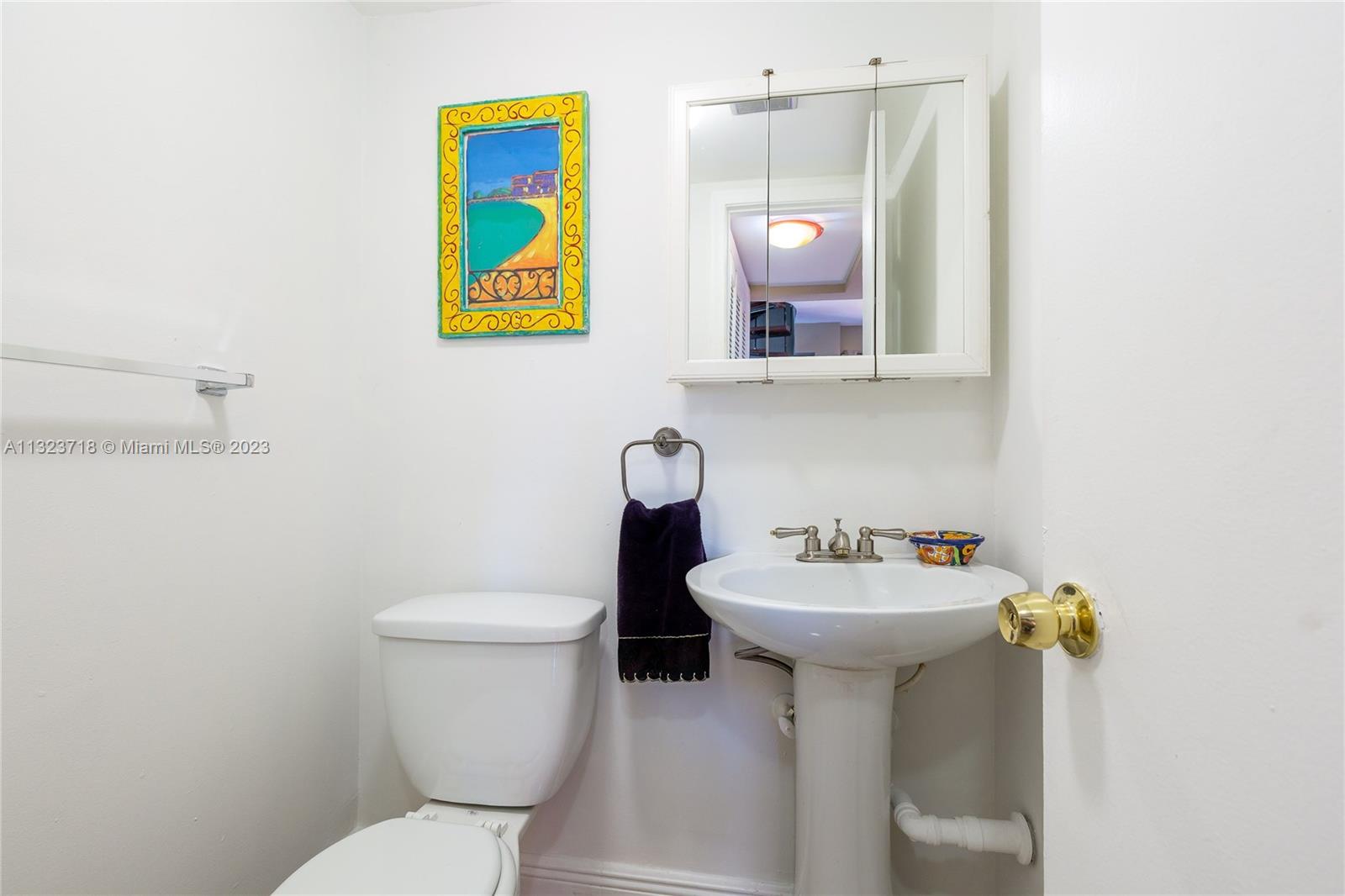 2743 Southwest 32nd Avenue Miami, FL 33133 - Photo 6 of 33 a bathroom with a sink mirror and toilet