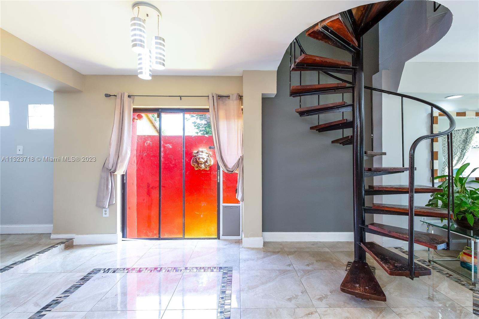 2743 Southwest 32nd Avenue Miami, FL 33133 - Photo 9 of 33 a view of staircase with a potted plant and a window