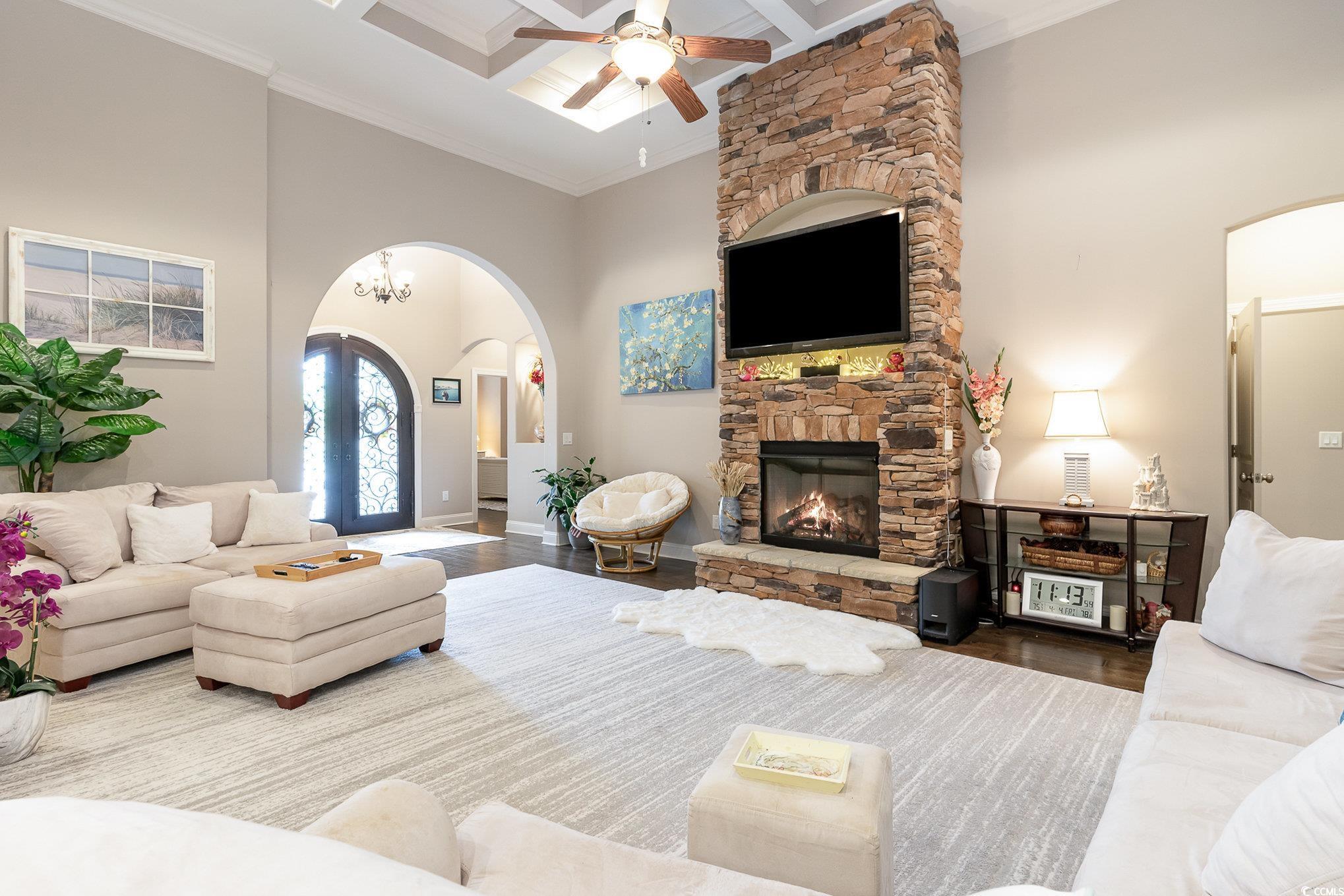 4049 Captiva Row Myrtle Beach, SC 29579 - Photo 4 of 40 Living room with a stone fireplace, arched walkway