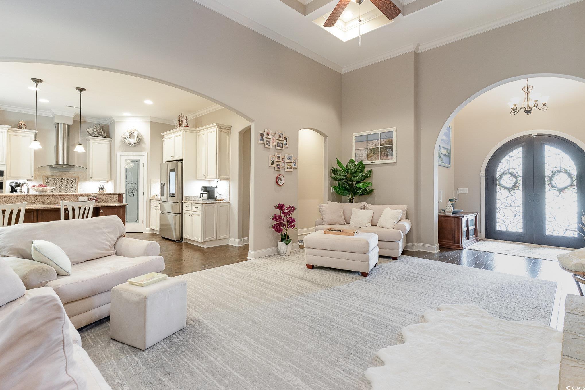 4049 Captiva Row Myrtle Beach, SC 29579 - Photo 6 of 40 Living area featuring baseboards, arched walkways,