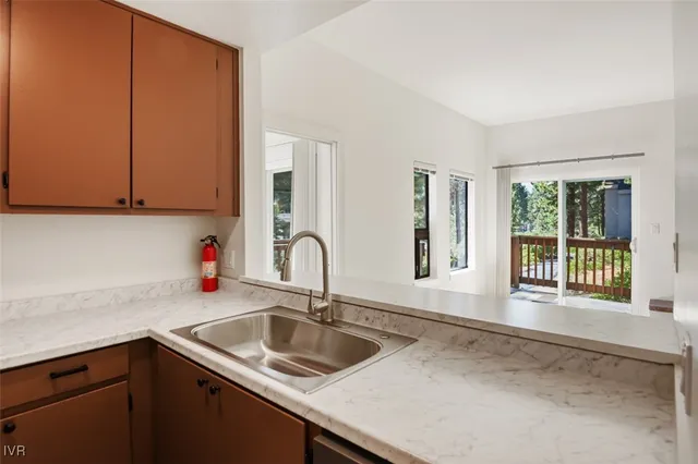 a kitchen with a sink and a window