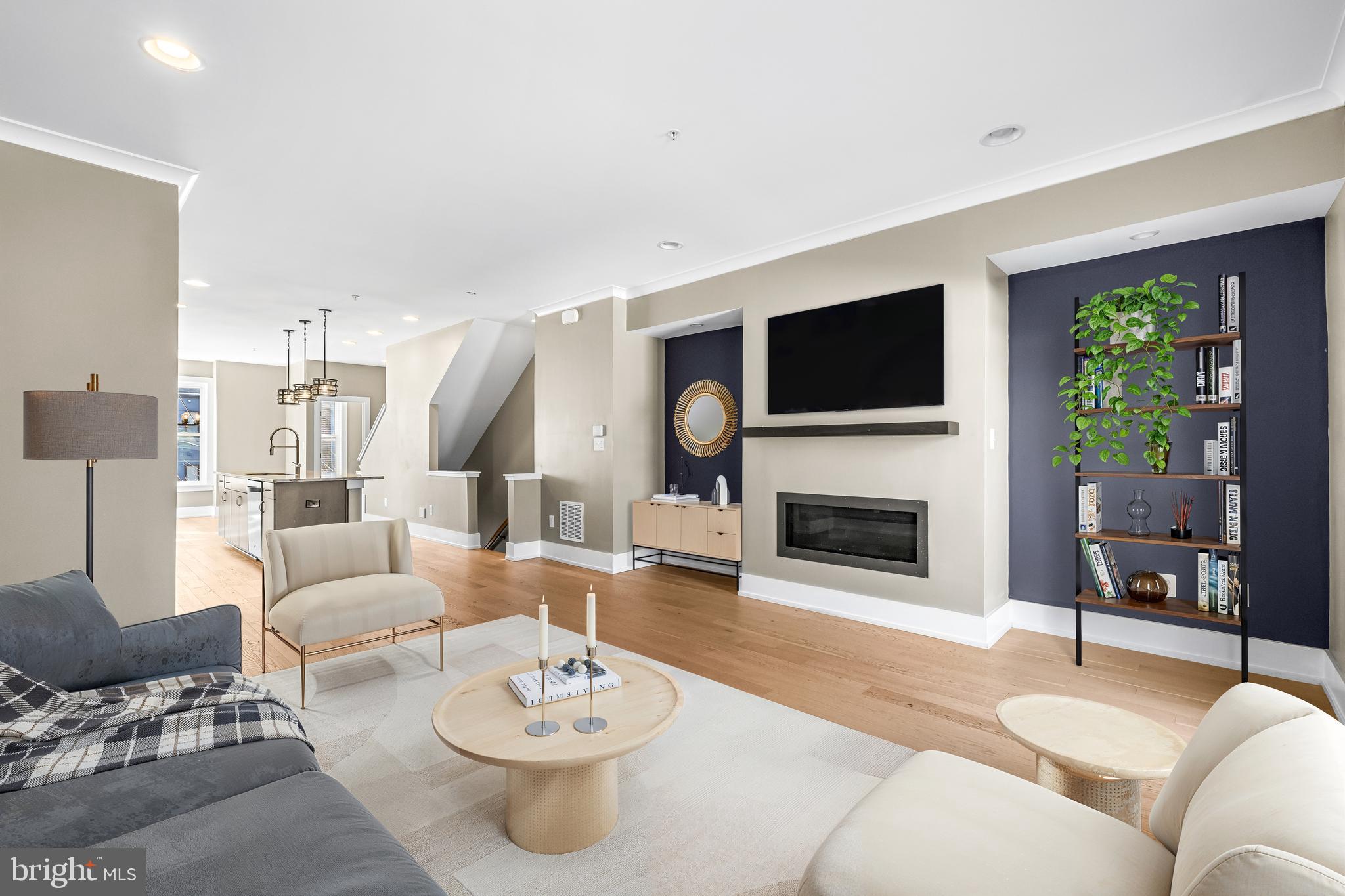 1456 Redfern Avenue Baltimore, MD 21211 - Photo 12 of 44 a living room with furniture a fireplace and a flat screen tv