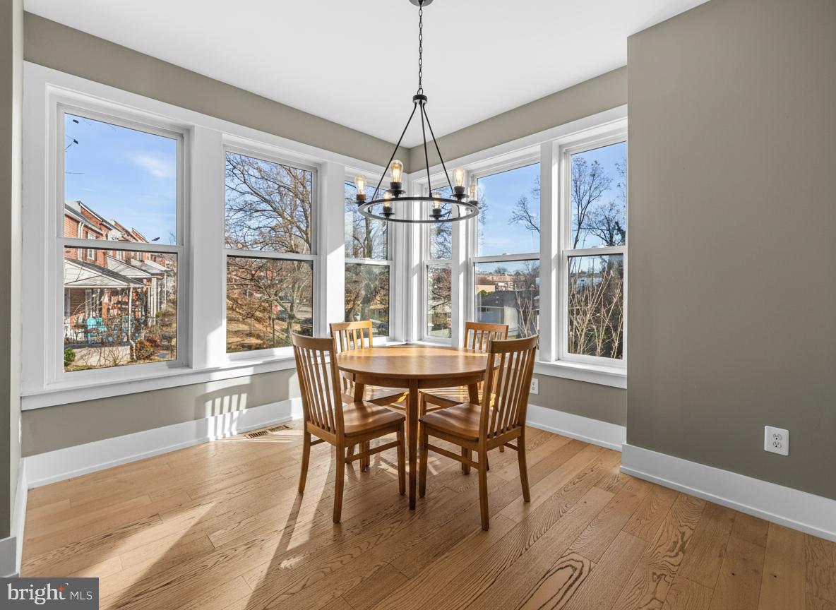 1456 Redfern Avenue Baltimore, MD 21211 - Photo 14 of 44 a view of a dining room with furniture window and wooden floor