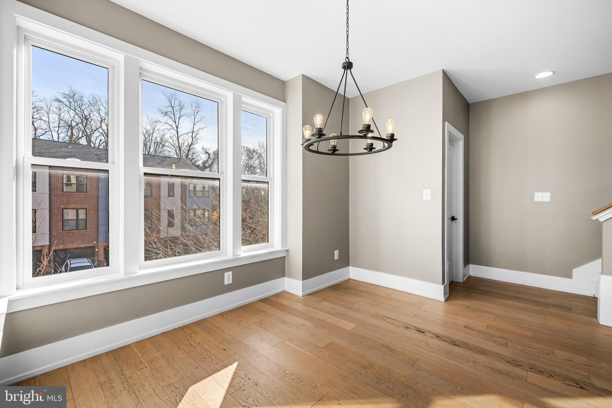 1456 Redfern Avenue Baltimore, MD 21211 - Photo 15 of 44 a view of empty room with wooden floor and window