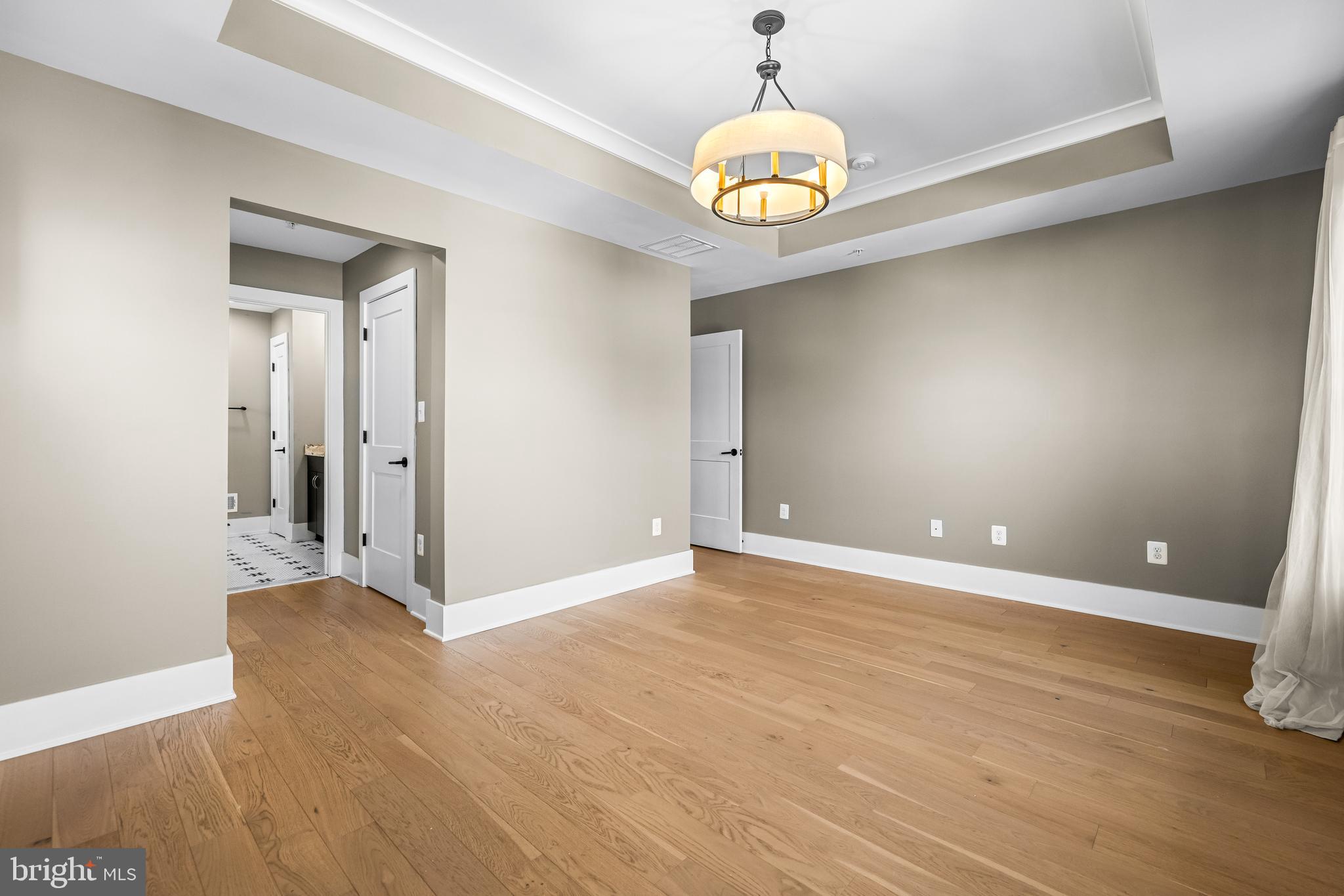 1456 Redfern Avenue Baltimore, MD 21211 - Photo 27 of 44 a view of an empty room with wooden floor