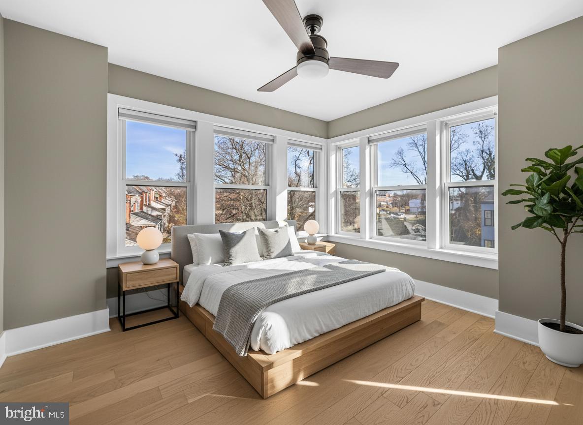 1456 Redfern Avenue Baltimore, MD 21211 - Photo 30 of 44 a bedroom with a large bed and a large window