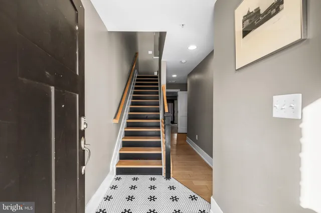 a view of entryway with wooden floor