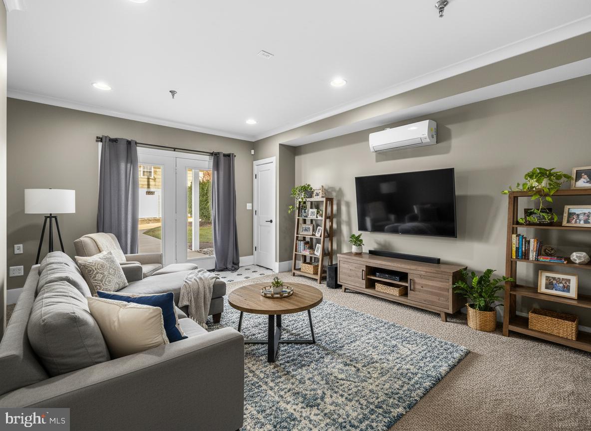 1456 Redfern Avenue Baltimore, MD 21211 - Photo 5 of 44 a living room with furniture and a flat screen tv