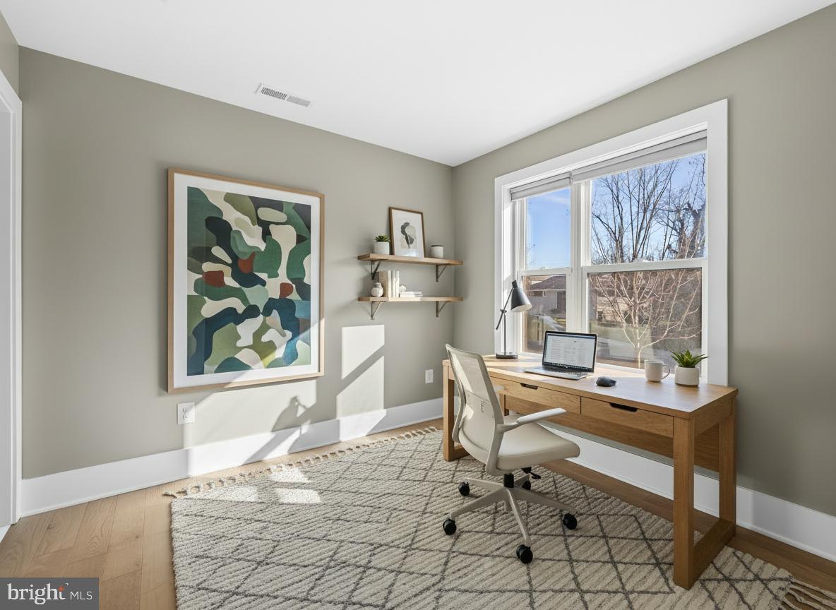 1456 Redfern Avenue Baltimore, MD 21211 - Photo 6 of 44 a workspace with wooden floor and a window