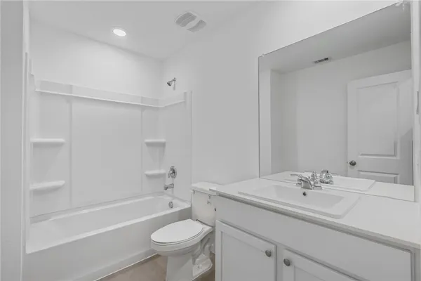 a bathroom with a sink a toilet and a bathtub