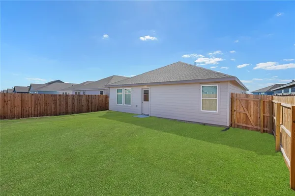 a view of a backyard with a garden