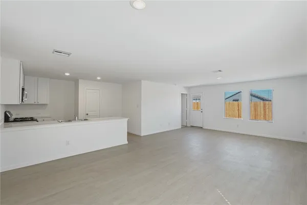 a view of kitchen and kitchen with furniture