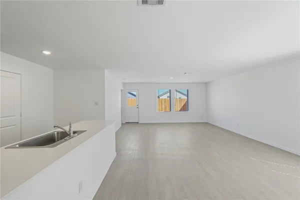 a view of a room that has a sink and a window