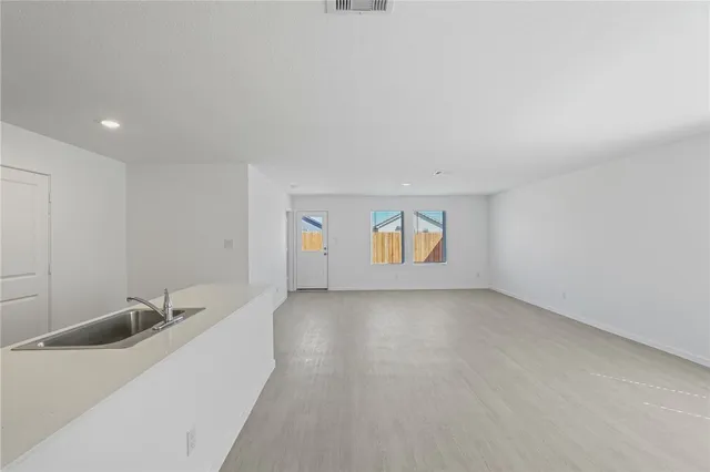 a view of a room that has a sink and a window