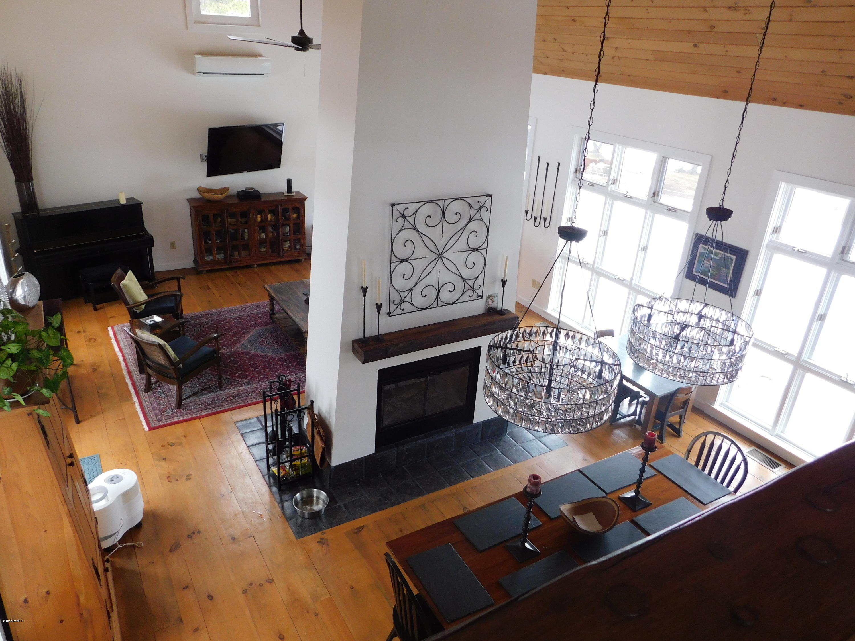 5 Jericho Road Hancock, MA 01267 - Photo 13 of 38 a living room with furniture and a fireplace