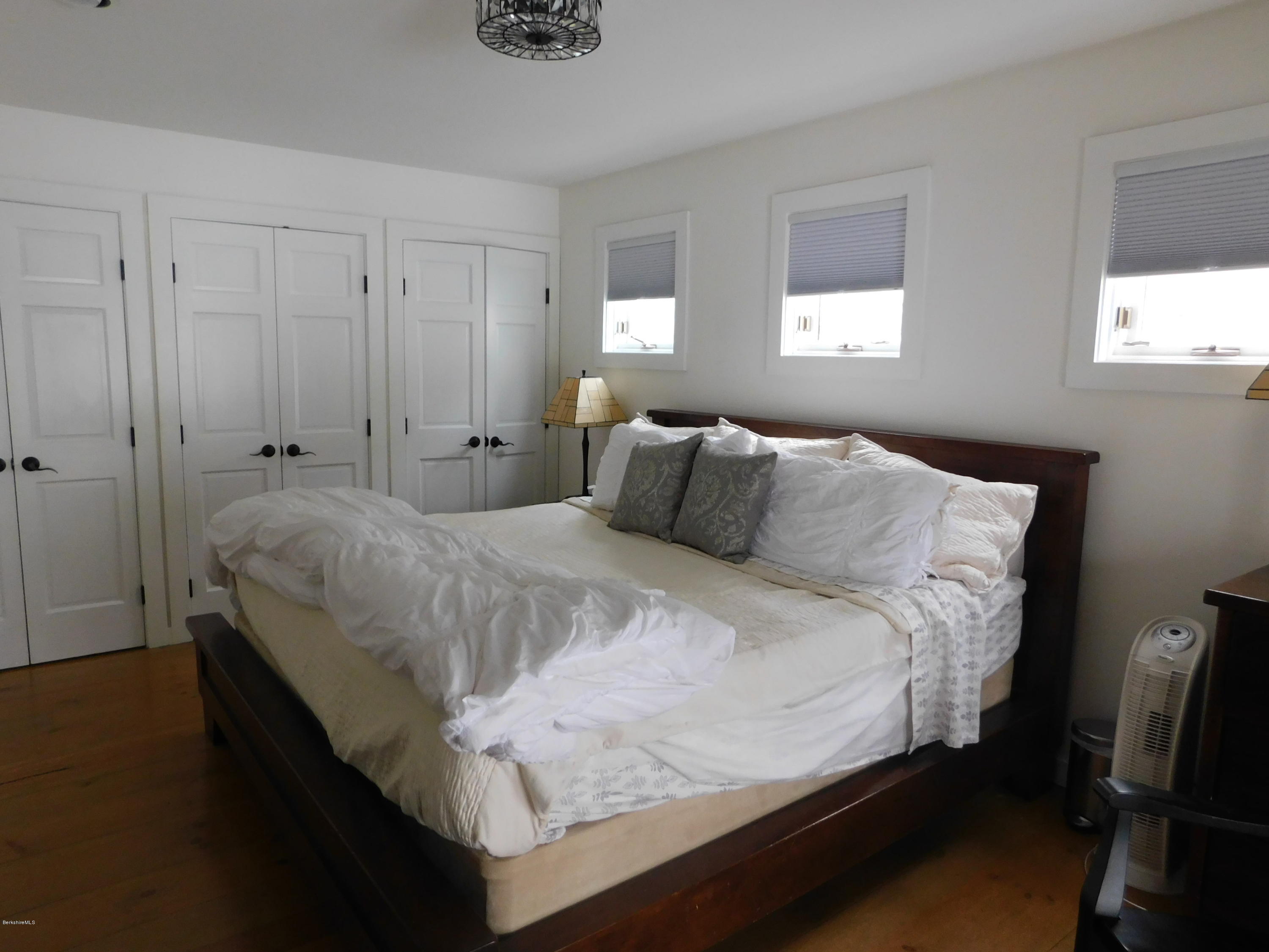 5 Jericho Road Hancock, MA 01267 - Photo 16 of 38 a bedroom with a bed and window