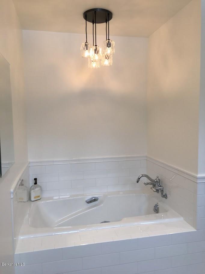 5 Jericho Road Hancock, MA 01267 - Photo 18 of 38 a bathroom with a bathtub