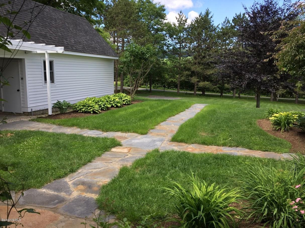 5 Jericho Road Hancock, MA 01267 - Photo 33 of 38 a view of a backyard with potted plants and large trees