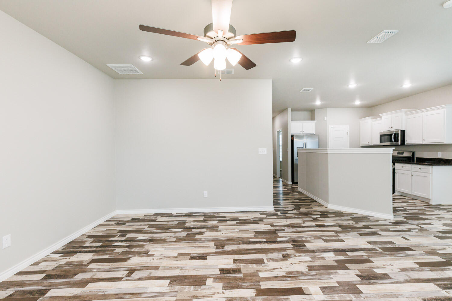 6956 12th Street Lubbock, TX 79416 - Photo 18 of 43 a view of kitchen and empty room