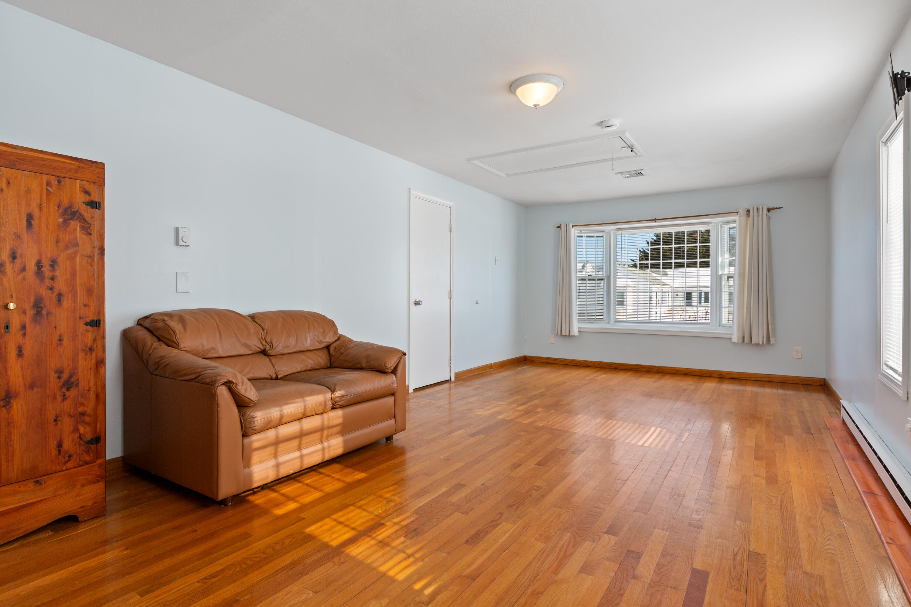183 Captain Chase Road Dennis Port, MA 02639 - Photo 12 of 44 a living room with furniture and a wooden floor