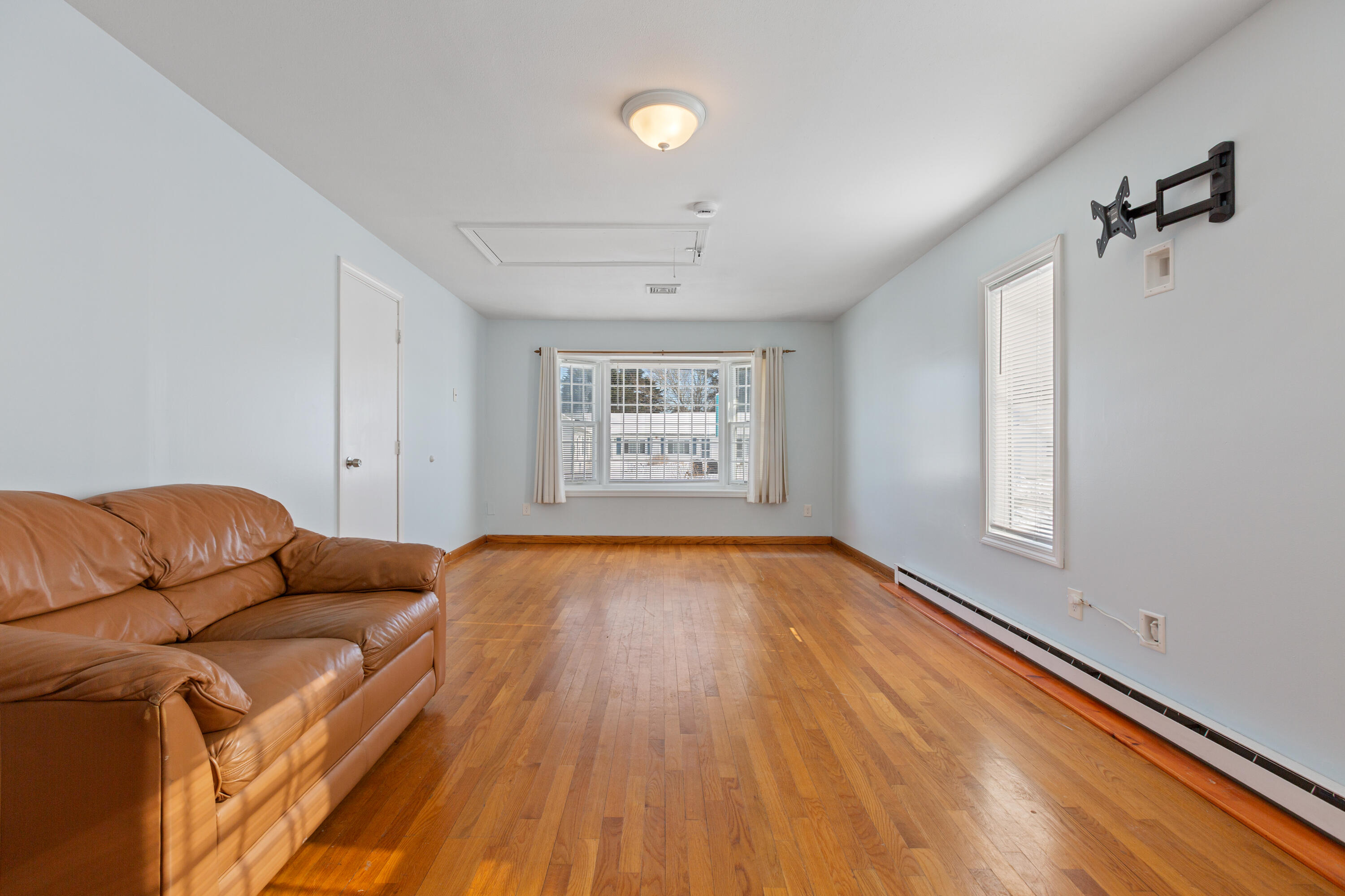 183 Captain Chase Road Dennis Port, MA 02639 - Photo 13 of 44 a living room with a bed furniture and a window