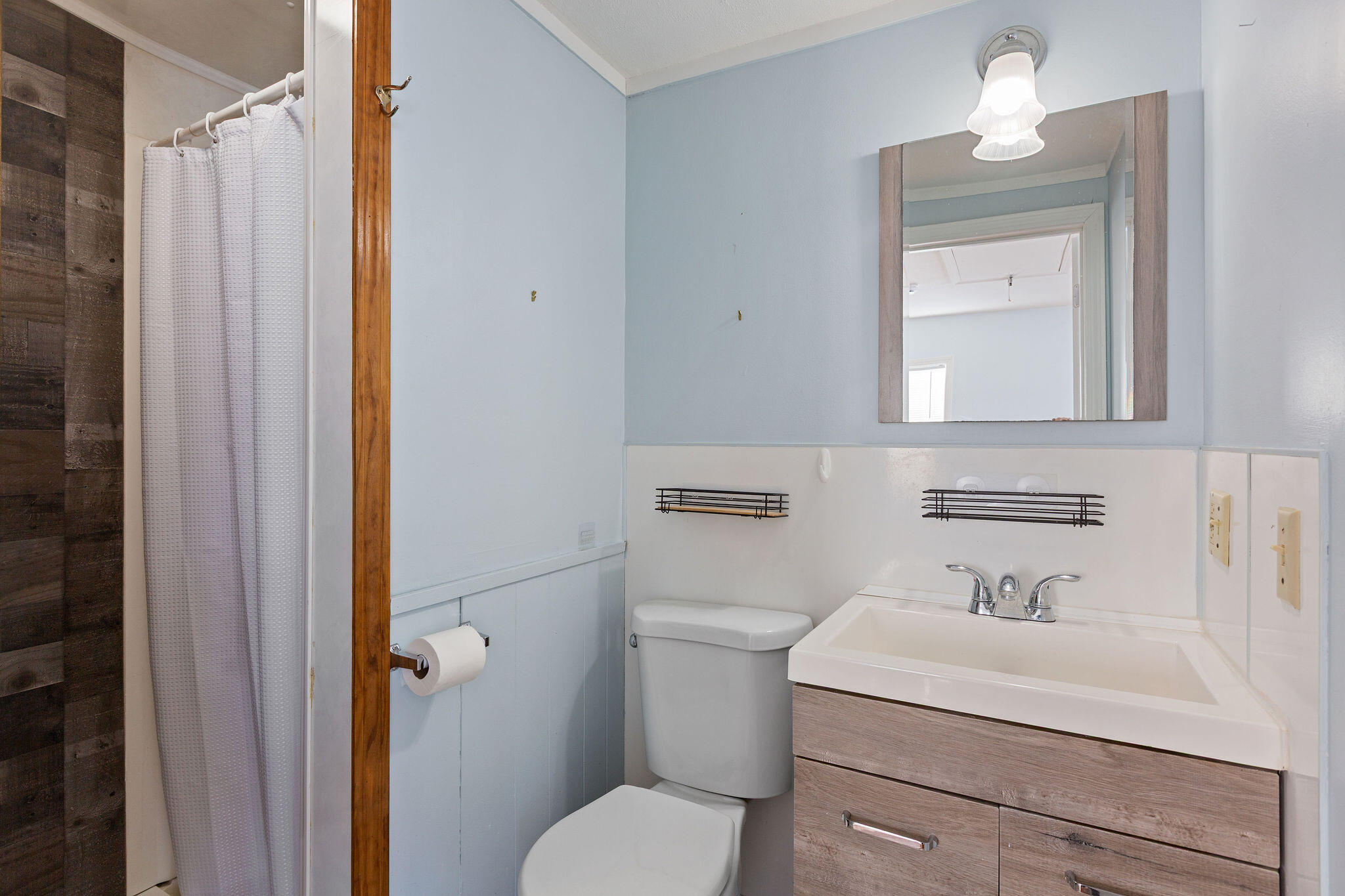 183 Captain Chase Road Dennis Port, MA 02639 - Photo 16 of 44 a bathroom with a sink a toilet and shower