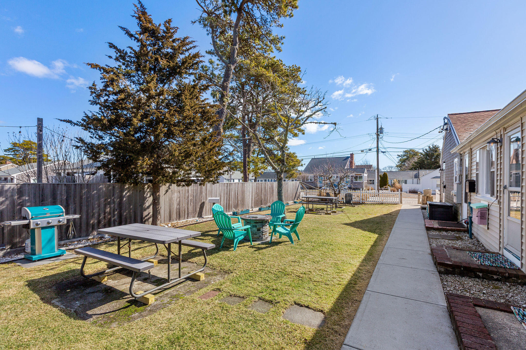 183 Captain Chase Road Dennis Port, MA 02639 - Photo 18 of 44 a swimming pool with some trees in the background