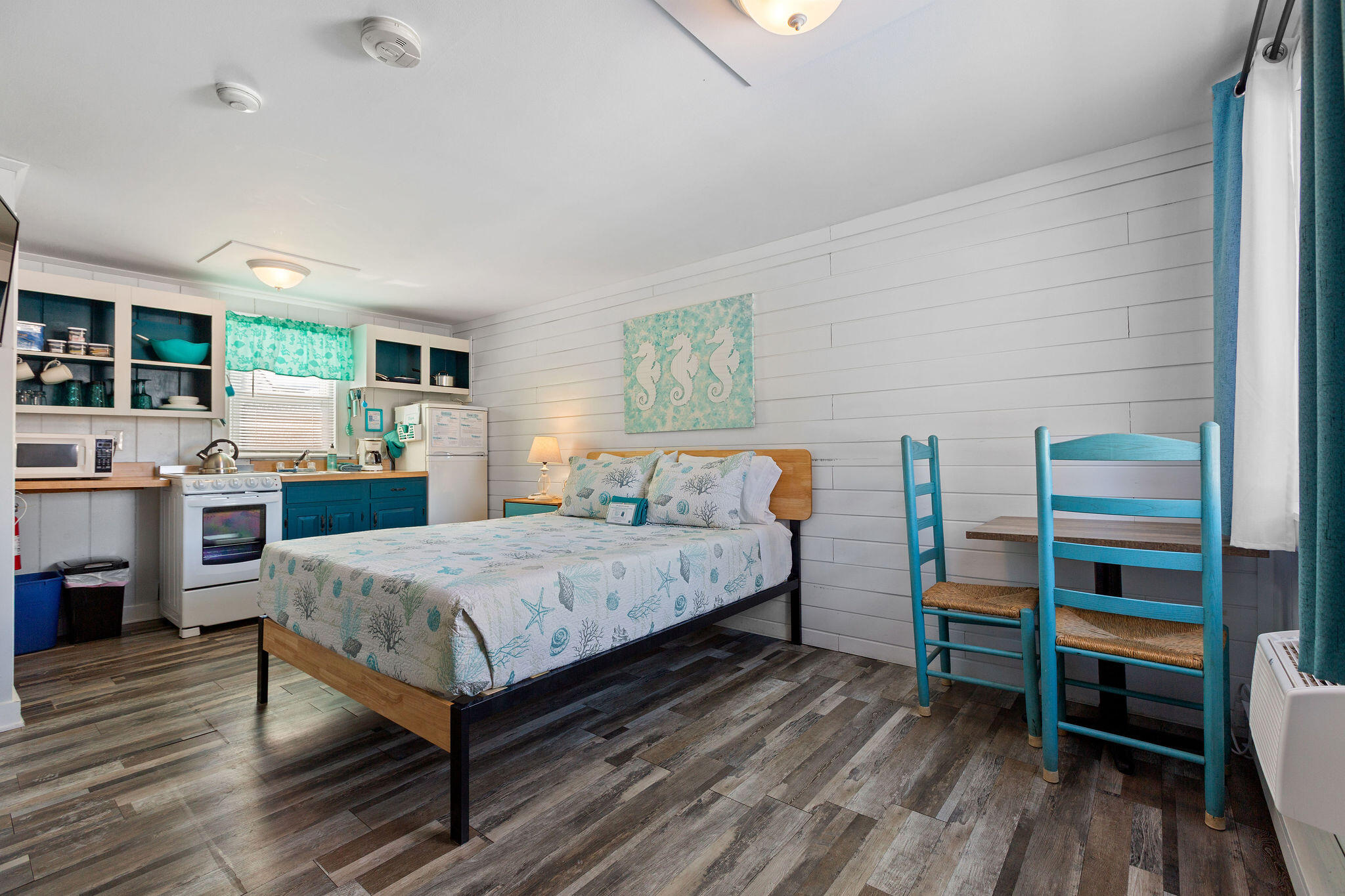 183 Captain Chase Road Dennis Port, MA 02639 - Photo 20 of 44 a bedroom with a bed and a book shelf