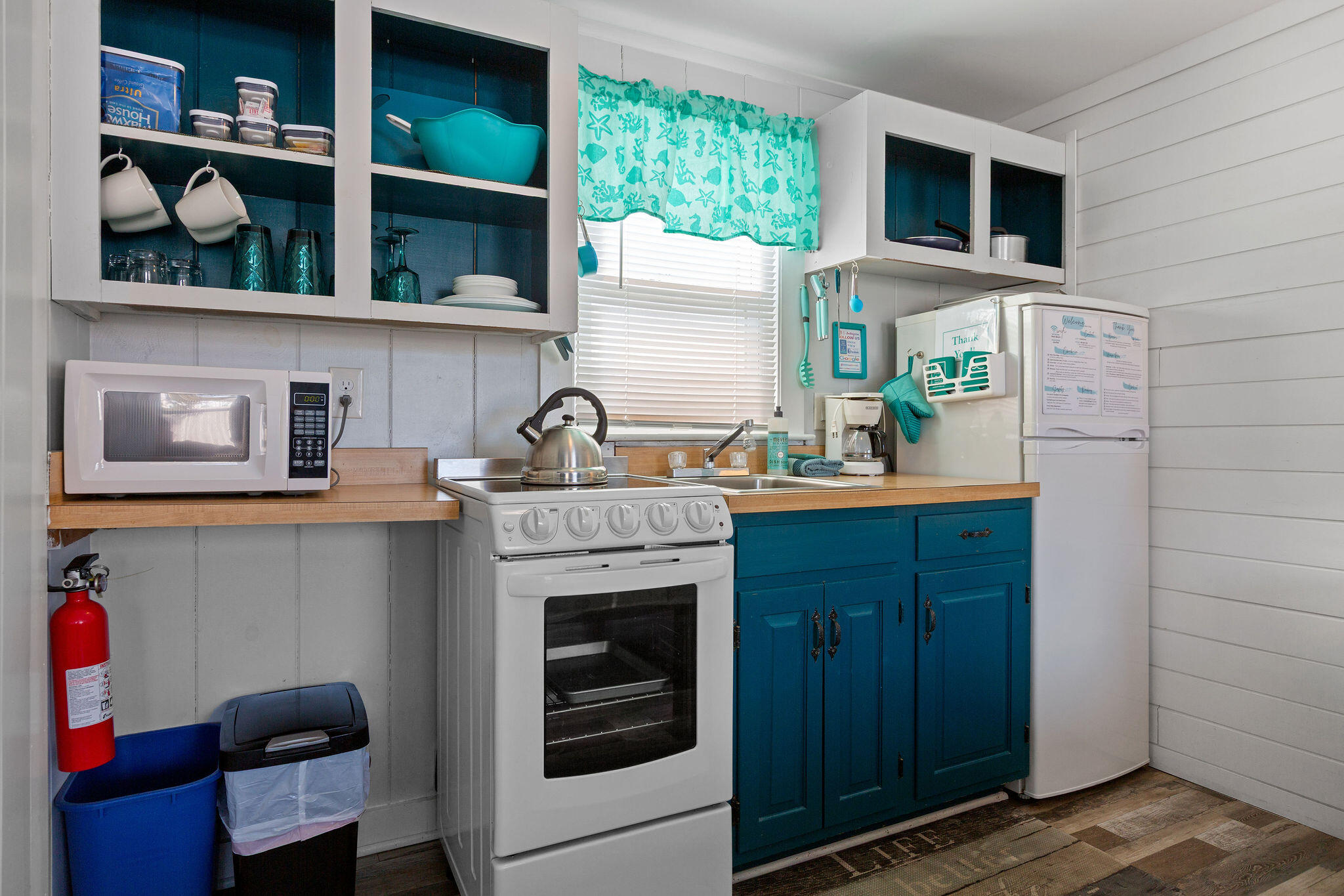 183 Captain Chase Road Dennis Port, MA 02639 - Photo 23 of 44 a kitchen with a sink cabinets and window