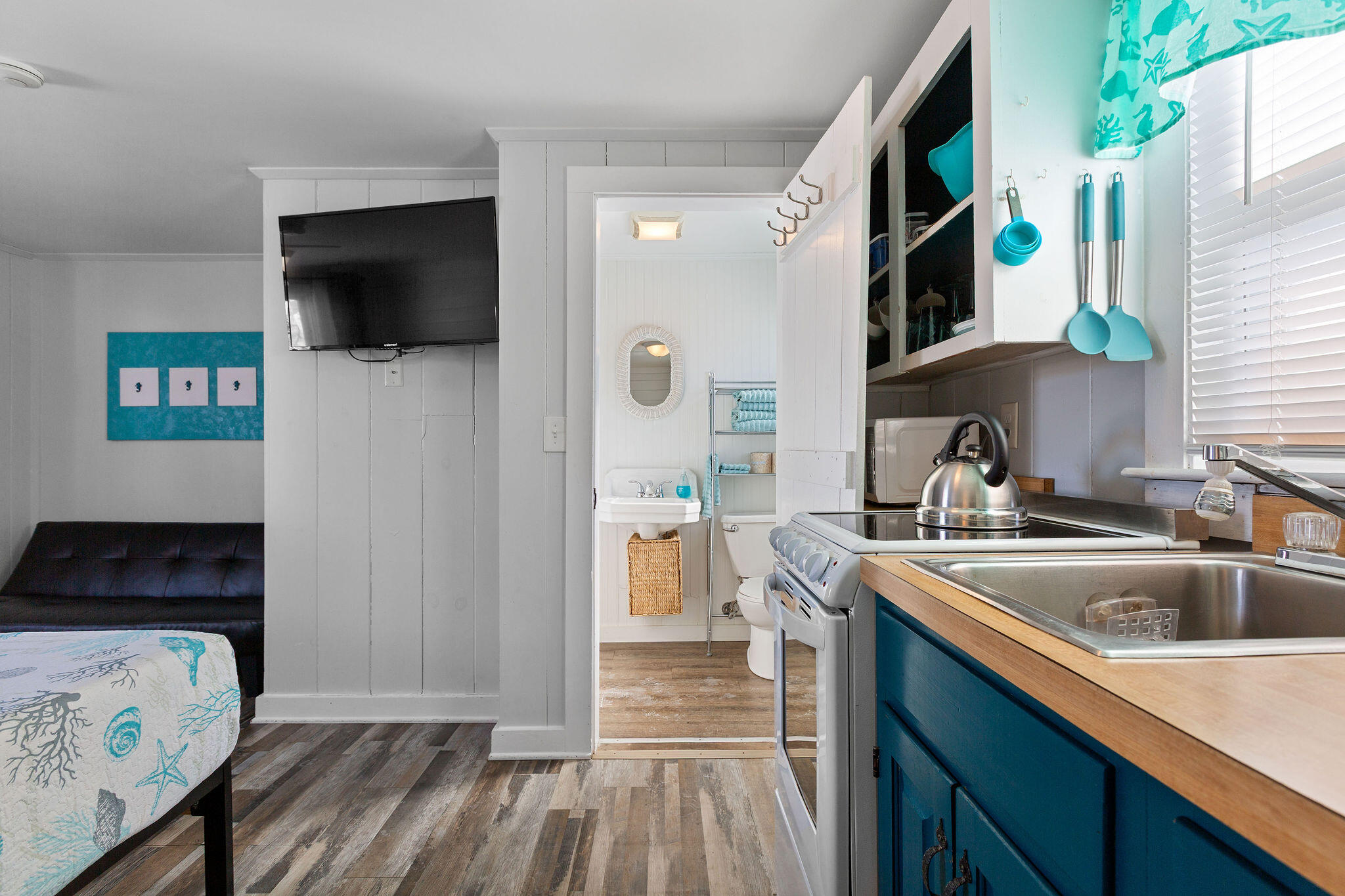 183 Captain Chase Road Dennis Port, MA 02639 - Photo 24 of 44 a kitchen with a sink and a stove top oven