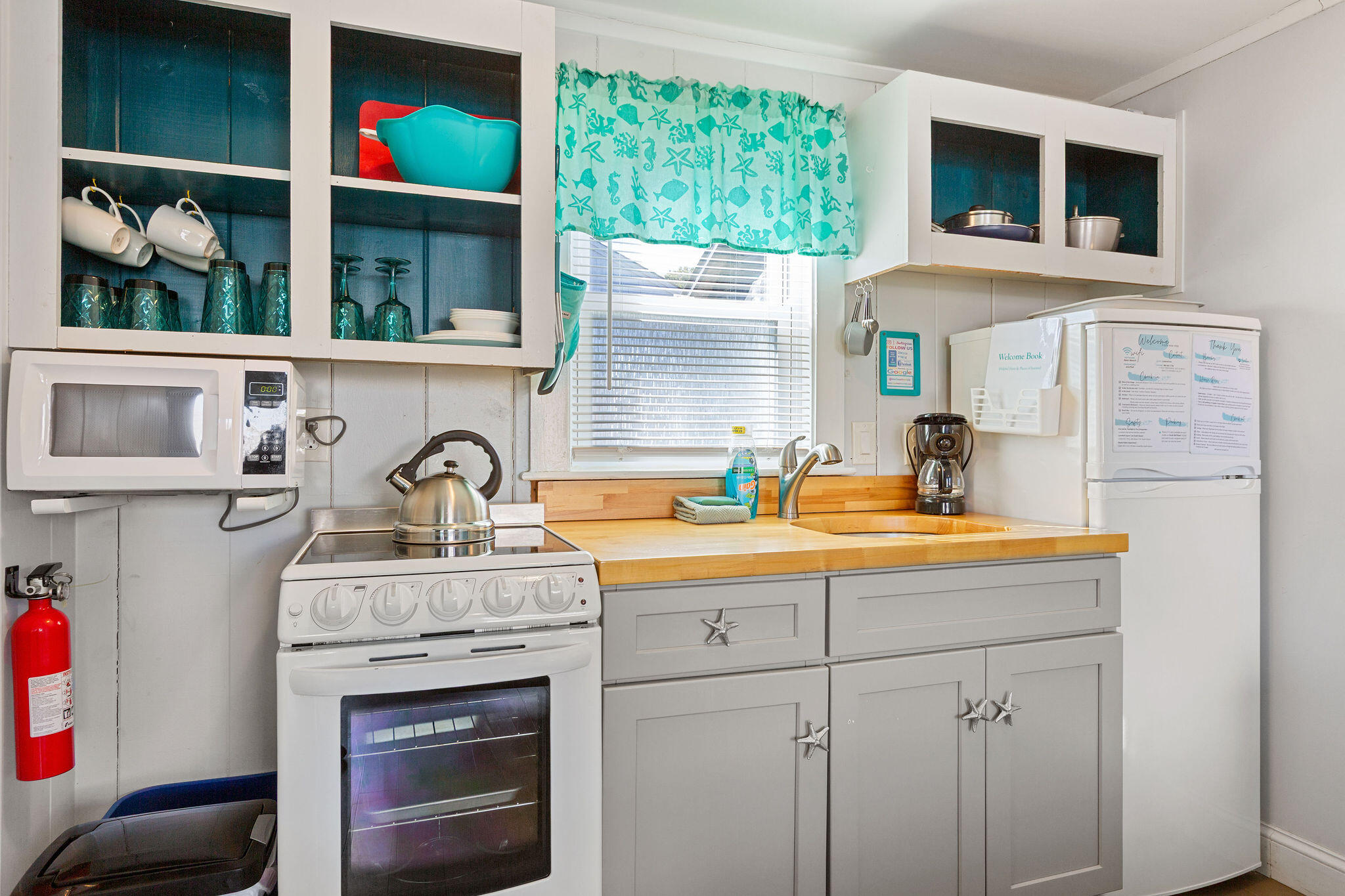 183 Captain Chase Road Dennis Port, MA 02639 - Photo 37 of 44 a kitchen with stainless steel appliances granite countertop a stove and a sink