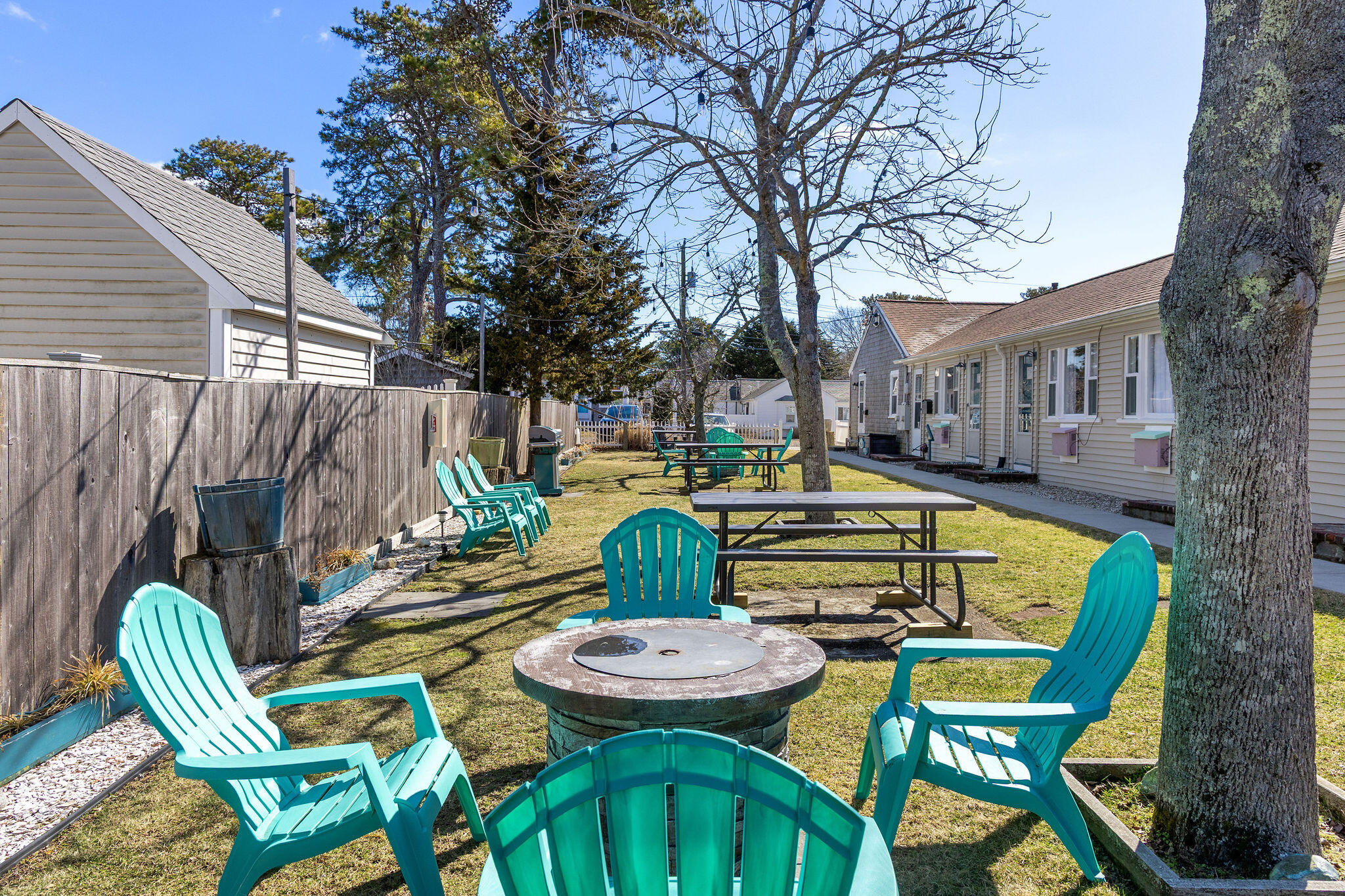 183 Captain Chase Road Dennis Port, MA 02639 - Photo 4 of 44 a view of a chairs and table in the patio