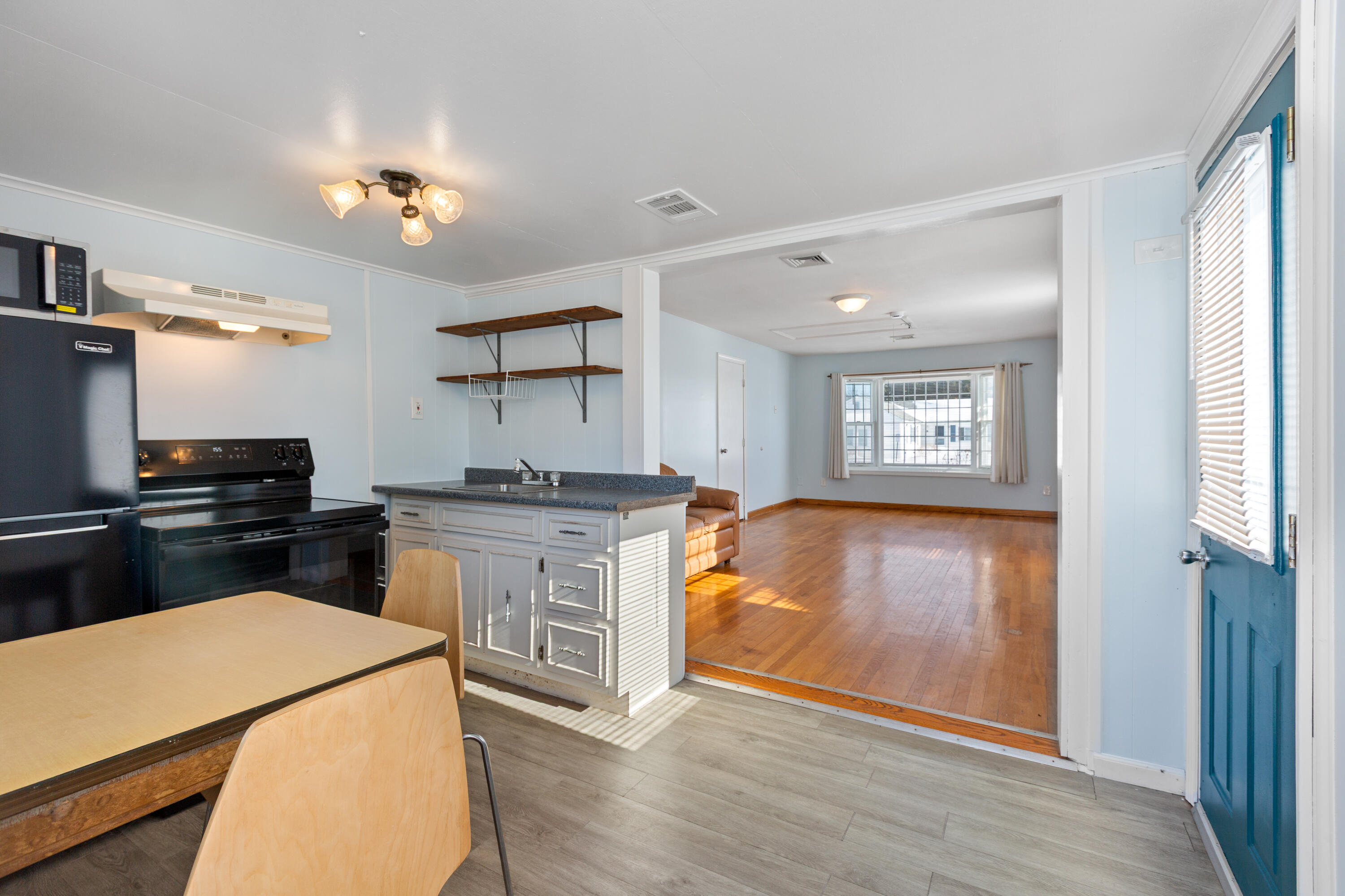 183 Captain Chase Road Dennis Port, MA 02639 - Photo 10 of 44 a kitchen with a refrigerator and a stove top oven