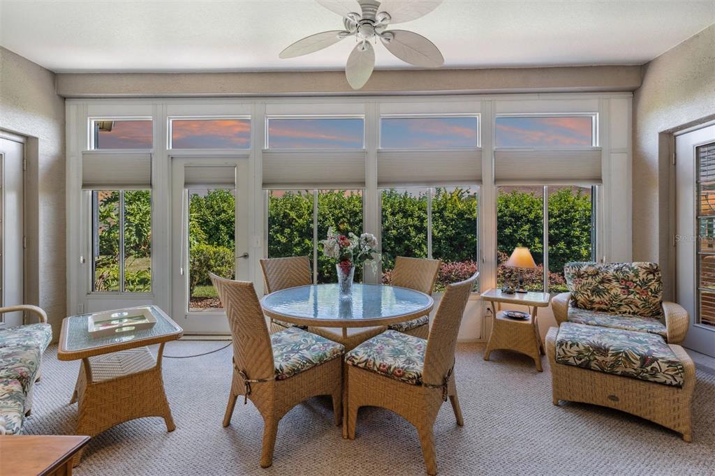 1630 Lakestone Drive Trinity, FL 34655 - Photo 11 of 49 a dining room with furniture large windows and a chandelier
