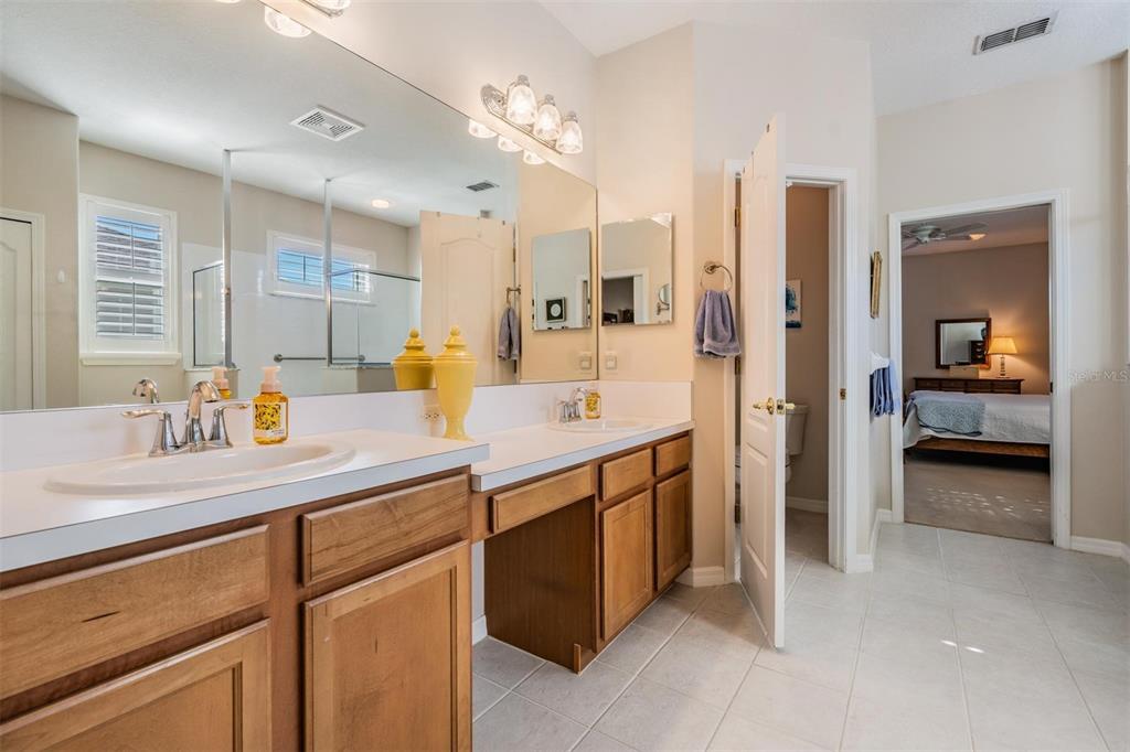 1630 Lakestone Drive Trinity, FL 34655 - Photo 14 of 49 a bathroom with a double vanity sink and a mirror