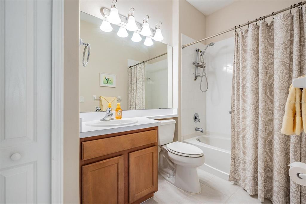 1630 Lakestone Drive Trinity, FL 34655 - Photo 17 of 49 a bathroom with a sink a toilet and a mirror