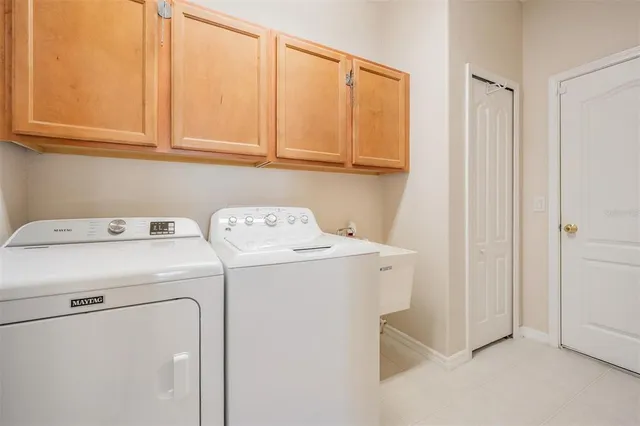 a utility room with dryer and washer