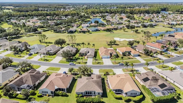 an aerial view of residential houses with outdoor space